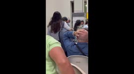 Passenger boards plane while wearing a life jacket