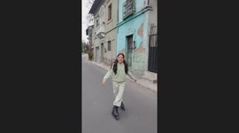 Kids collide as one rides a bike and the other skates backward in Quito