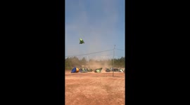 Dust devil tornado picks up tents at campsite
