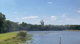 Helicopter grapples with wildfire in Stuart, Florida