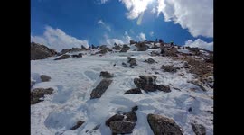 Terrifying moment mountaineer dodges huge falling rock with timely leap