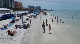 US: Beachgoers at Clearwater Beach in Florida on a hot Saturday