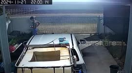 Pickup truck crashes through driveway gates in front of shocked family
