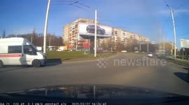 Lorry overturns on roundabout and spills load onto road
