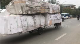 Wild motorbikes are ridiculously overloaded with countless foam boxes, It is like a giant truck! with a length of about 7 meters