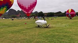 Electric air taxi flips over in botched take-off in China