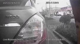Towed car slides off and smashes rear window