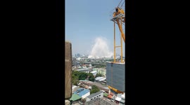Crane operator holds tight while stuck on rooftop in Bangkok during earthquake