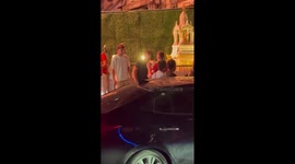 Tourists and a Thai girl have argument outside bars in Bangkok