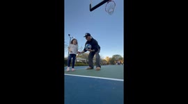 Dad Blocks Daughter's Theme Park Basketball Shot