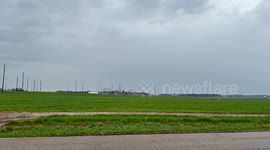 Blown over field crop sprayer/boom sprayer - Storm damage from tornado activity in Evansville, Indiana on April 2, 2025