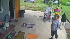 Grandmother topples backwards as she tries to sit on sun chair