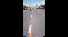 Motorcycle rider seen carrying another bike on the back of his