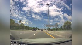 Driver clipped by pickup truck and hurtles into ten-wheeler lorry