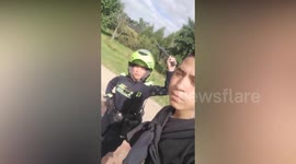 Policewoman whacks young man with baton for recording her during search