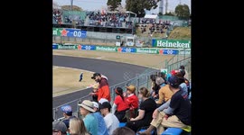 Suzuka 2025 a track staff member has an escape as he crosses track with cars still running