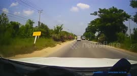 Billboard topples over onto oncoming motorcycle rider
