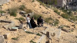 A somber Eid: Gazans visit graves of family members killed in Israeli Strikes (2)