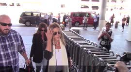 Paparazzi trip over as they photograph Jennifer Aniston at LAX airport