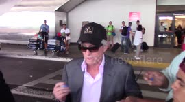 Michael Douglas signs autographs at LAX Airport