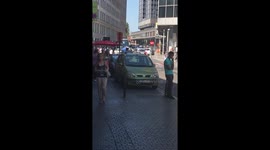 Police hold man at gunpoint after possible bomb alert in Brussels