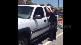 Police open locked car to rescue puppy on a hot day