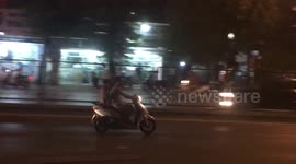 Dog on a  scooter in Hanoi