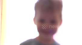 Toddler Photographer takes pictures with camera