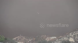DC-10 fire-bomber making retardant drop at