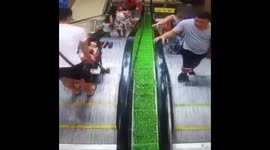 Baby in buggy rolls down escalator