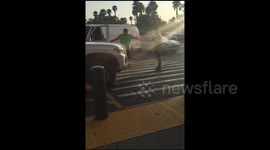 Pedestrian confronts motorist in a car park