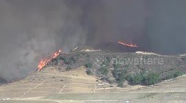 Tilted fire vortex and flare-up at