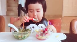Cute baby eats food