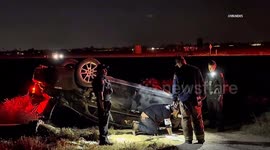 US, Bakersfield: Bakersfield Car Jumps Railroad Tracks and Lands on Roof