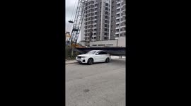 Bungling crane operator drops huge length of steel mesh onto boss's BMW