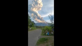 Worried locals watch as Mount Kanlaon volcano erupts in the Philippines