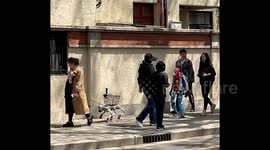 Robot dog carries shopping as robot 'child' wearing clothes strolls behind