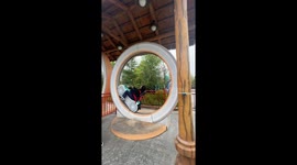 Watch a tourist take on this hilarious loop-the-loop bicycle in China