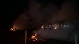 Hungary: Hungarian farmers light fires in peach orchards to protect crops from frost