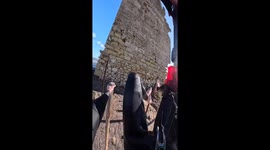 Kitesurfer rides up building then launches into the air in France