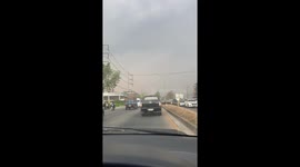 Cotton flowers blow onto road creating snow-life effect in Thailand
