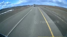 Lorry swerves to avoid head on crash and overturns