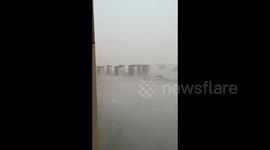 China: Overlooking a Foggy City from a High-Rise
