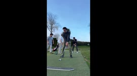 Golfer swings so hard his club goes flying over bushes and into nearby road