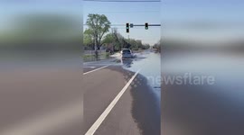 US: Flooding Hits Road Intersection