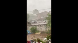 Storm tears roof from huts as monsoon season nears in Thailand