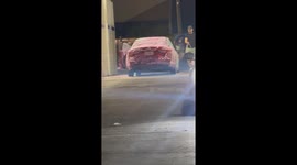 Man Washes Car Interior With Hose