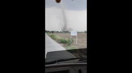 Terrifying waterspout tears through field near homes in Myanmar