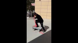 Worker slams downhill while trying to ride trolley like a skateboard
