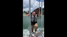 Chubby guy struggles to ride water jet pack